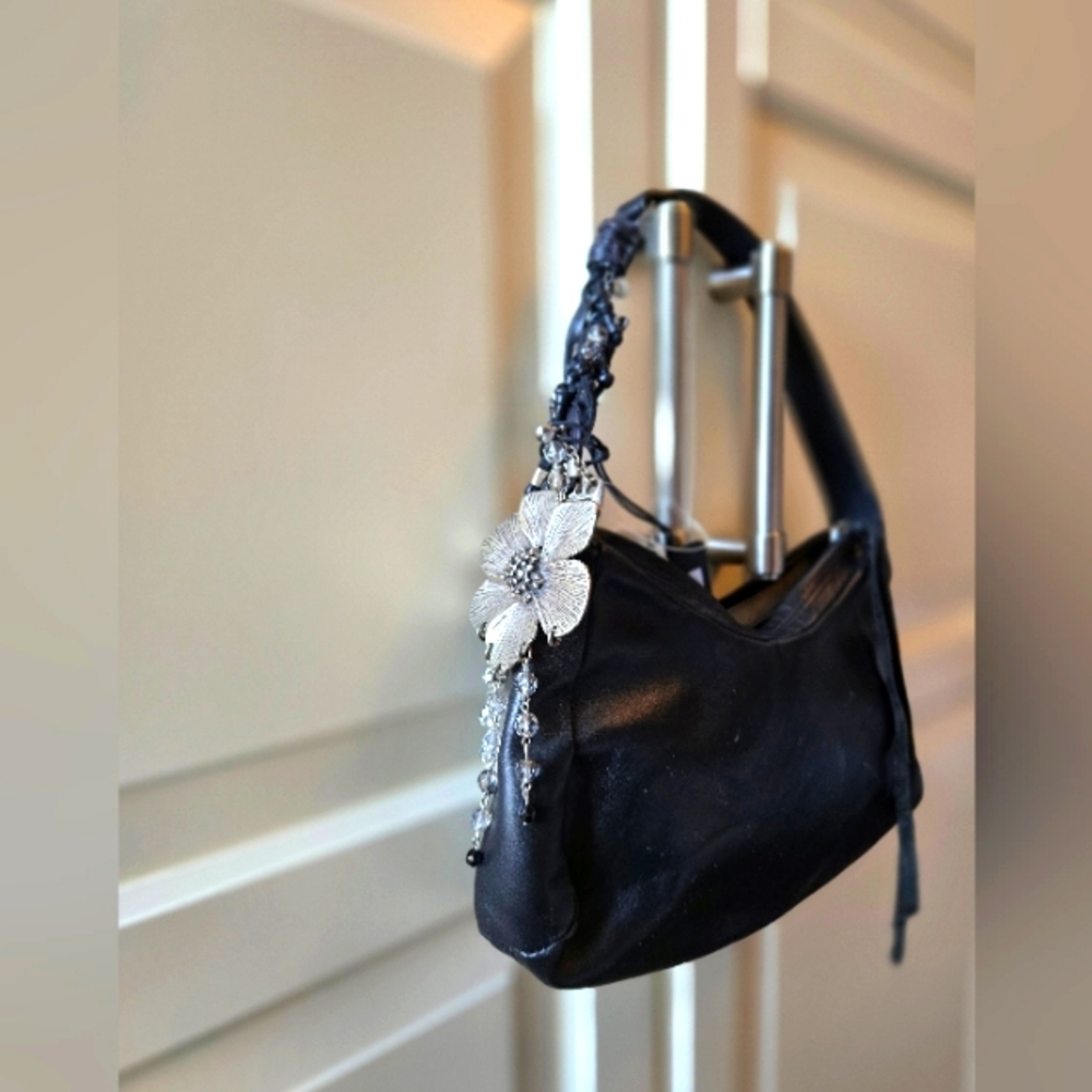 Black  leather hand bag with floral detail
